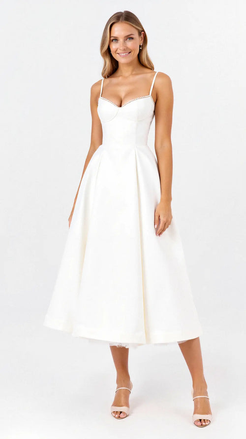 White corset-style midi dress with pleated skirt and spaghetti straps — front angle.