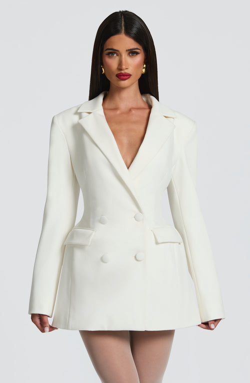 White double-breasted blazer mini dress — front view showing lapel neckline and structured shoulders.