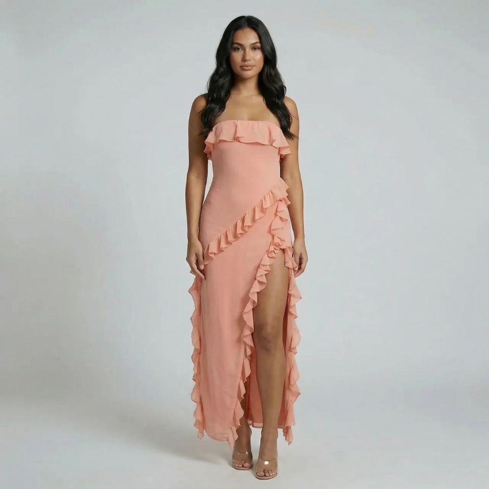 Rose gold strapless ruffle maxi dress with high slit and flowing accents