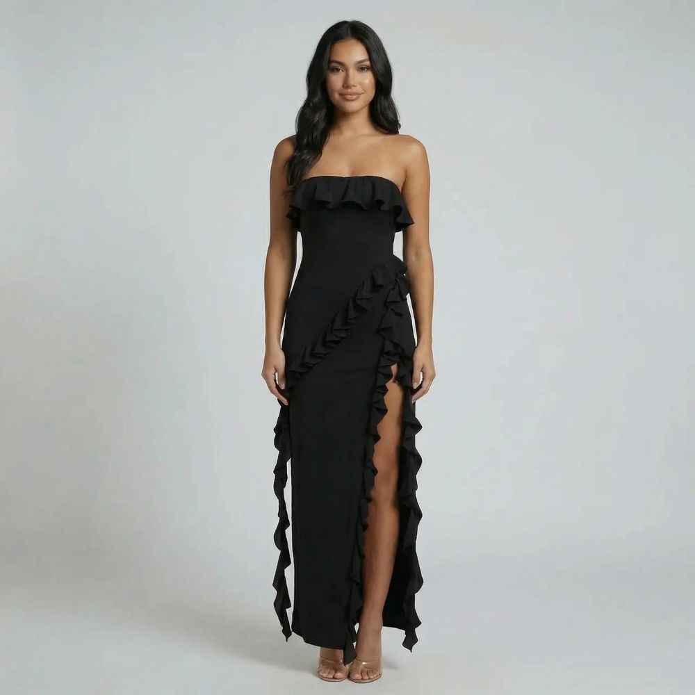 Black strapless ruffle maxi dress featuring a bandeau neckline and side slit