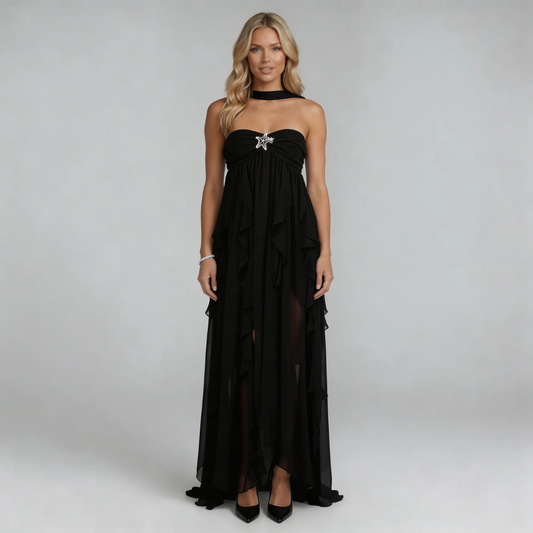 Black ruffle maxi dress with sweetheart neckline — front view showing cascading ruffles and star embellishment.