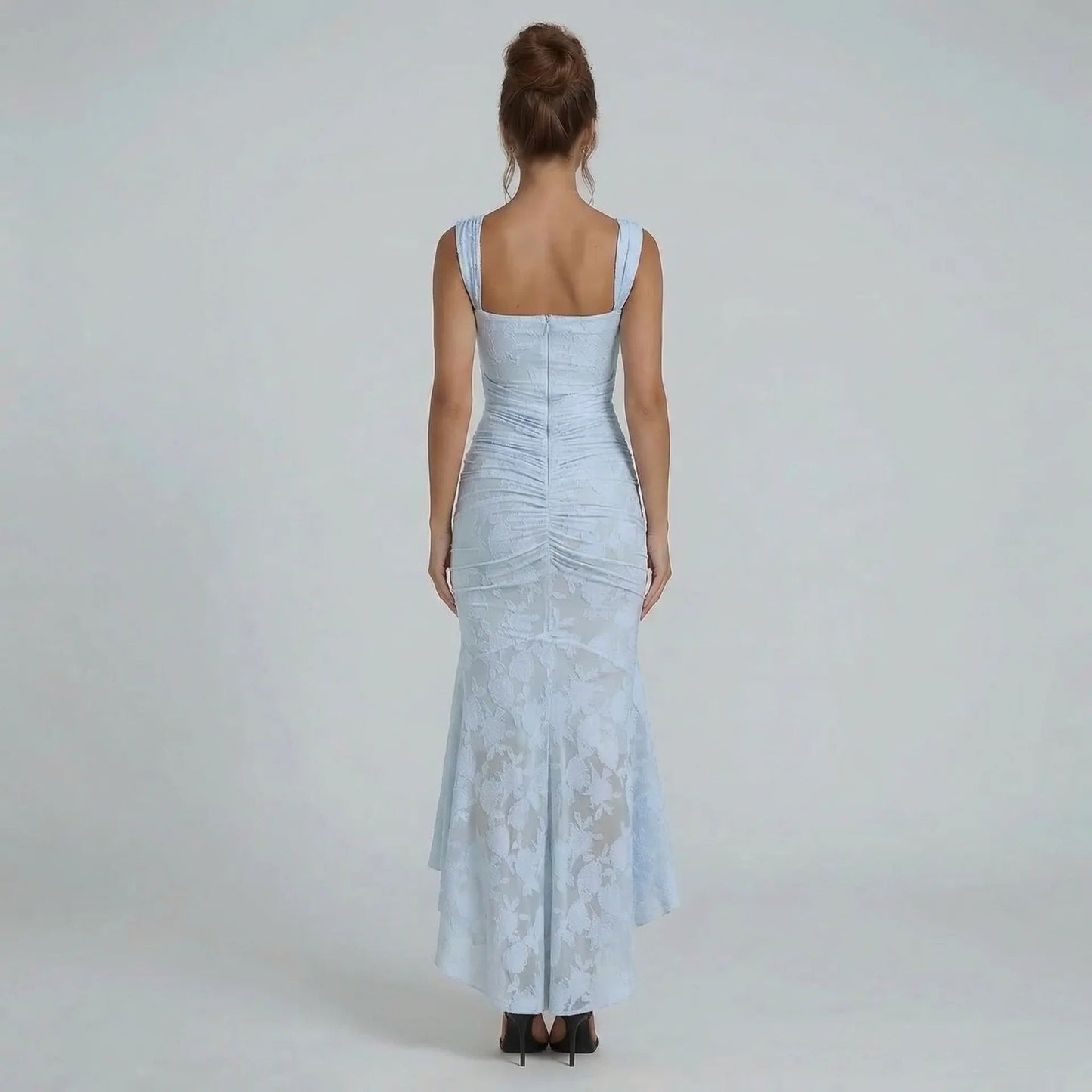 Light blue lace maxi dress — back view highlighting ruched wrap and delicate lace detailing.