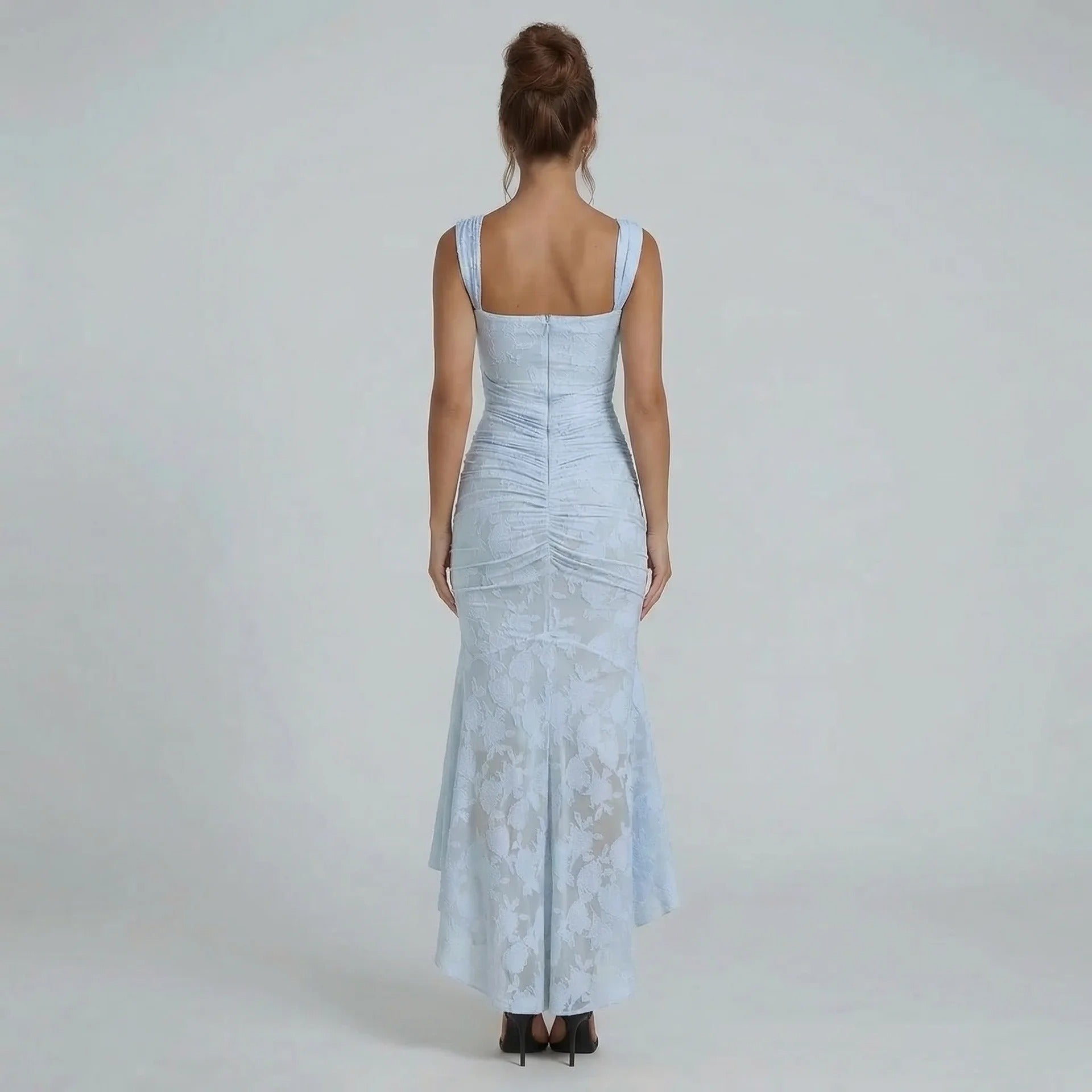 Light blue lace maxi dress — back view highlighting ruched wrap and delicate lace detailing.
