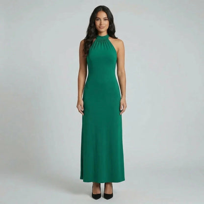 Emerald green halter ruched maxi dress — front view highlighting maxi length elegance.