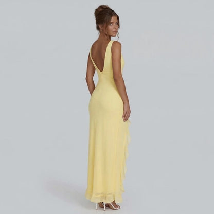 Yellow ruffle maxi dress — back view showing open V-back and flowy silhouette
