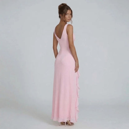 Pink maxi dress — back view showing tailored fit and flowing hem