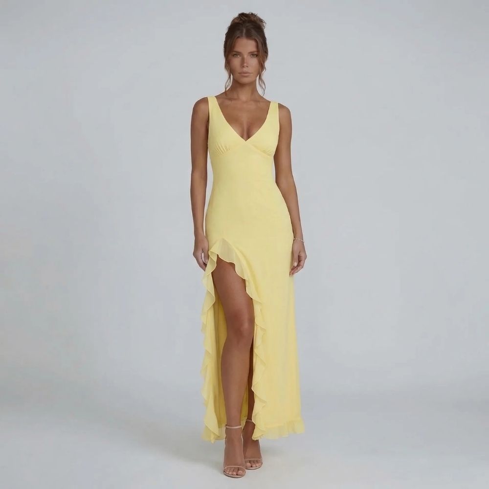 Yellow ruffle maxi dress with V-neckline — front view highlighting cascading slit