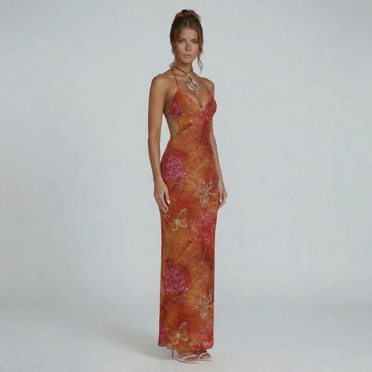 Red floral halter neckline maxi dress with side cutouts — front view showcasing plunging neckline and sculpted fit.
