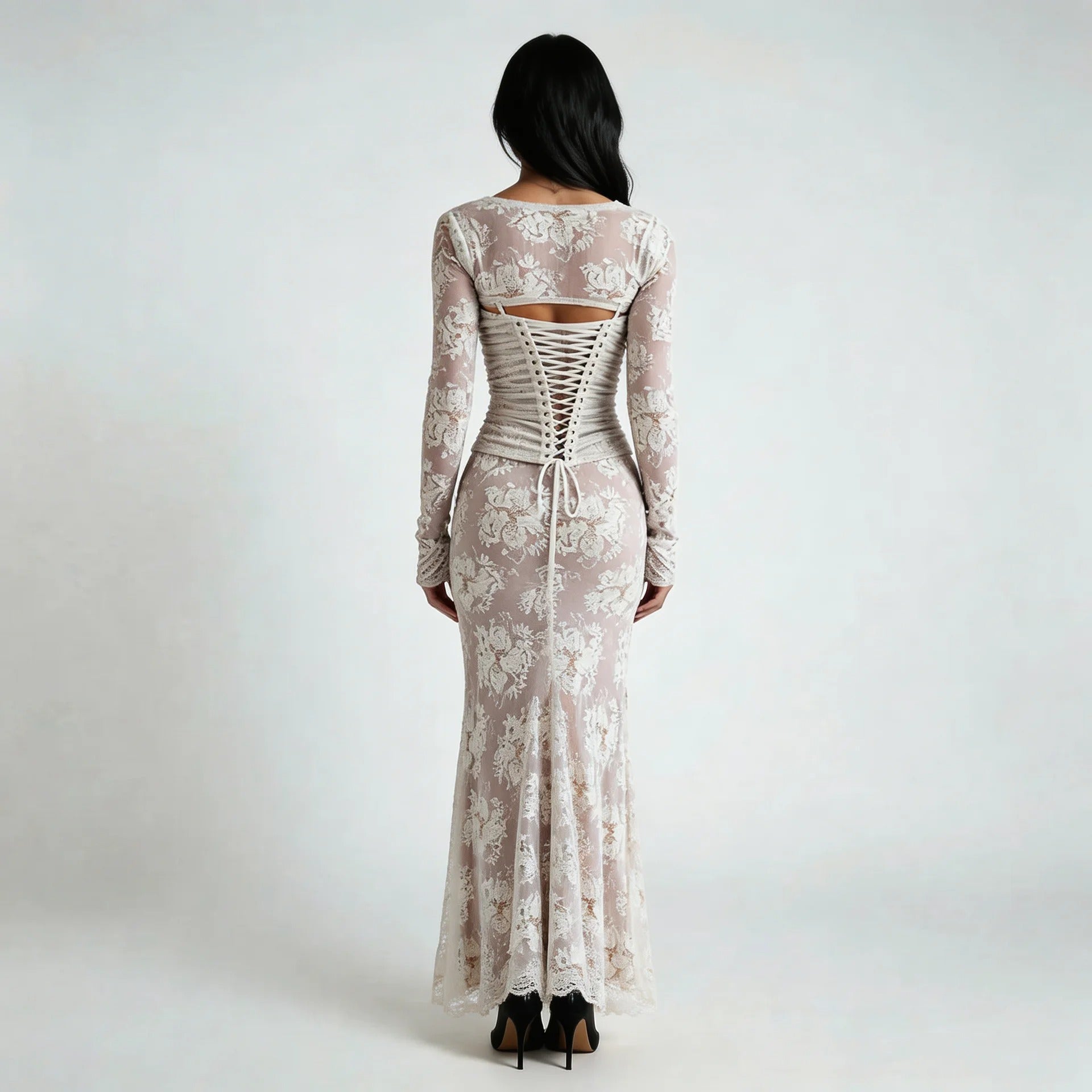 White lace maxi dress with corset lace-up back and floral details — back view highlighting the design.