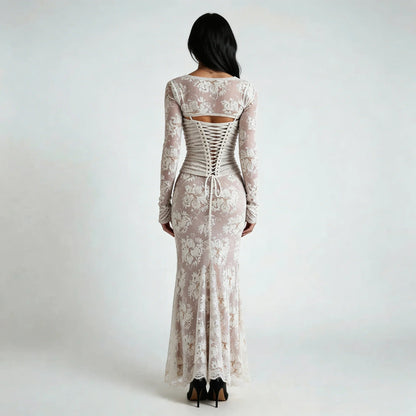 White lace maxi dress with corset lace-up back and floral details — back view highlighting the design.
