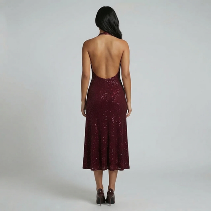 Red sequin midi dress with open back detail — back view on model.