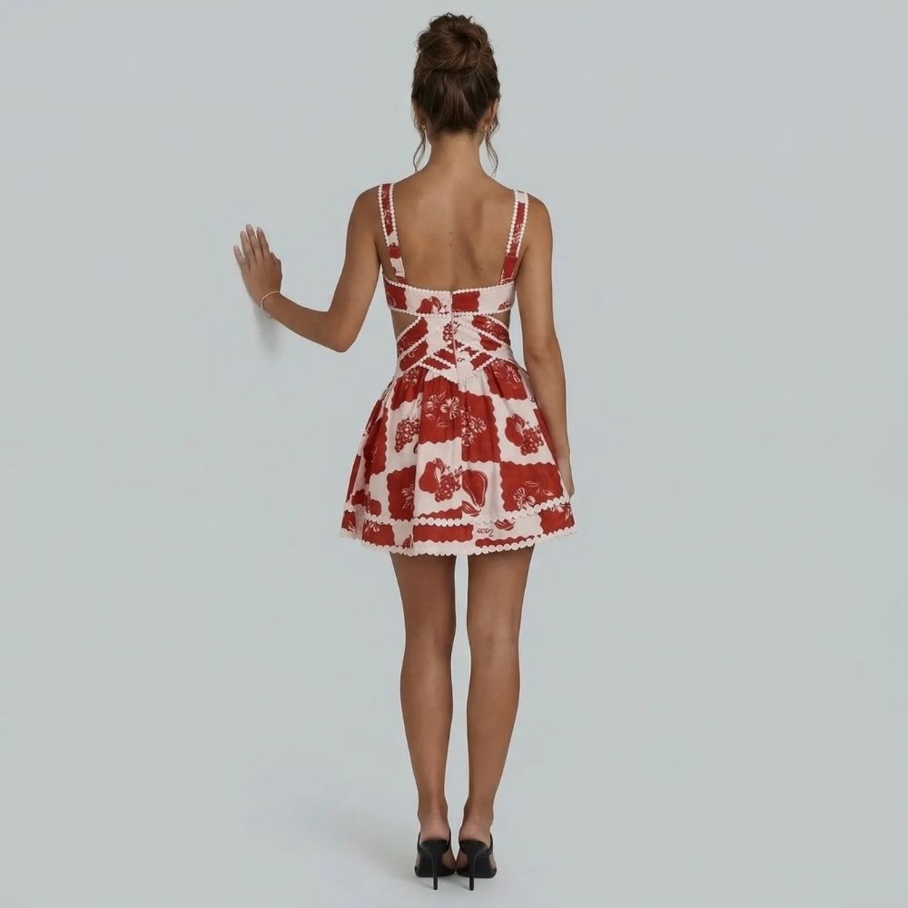 Red floral patchwork mini dress — back view highlighting open back and crisscross trim
