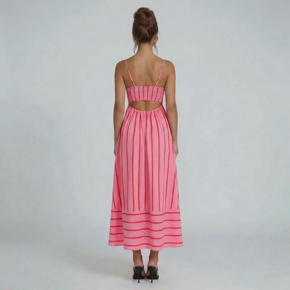 Pink striped maxi dress with smocked back and open-back detail — back view showcasing cutout design.