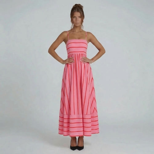 Pink striped maxi dress with straight neckline and spaghetti straps — front view showing flowing skirt.