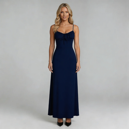 Navy lace-up maxi dress with sweetheart neckline — front view showcasing flowing silhouette.