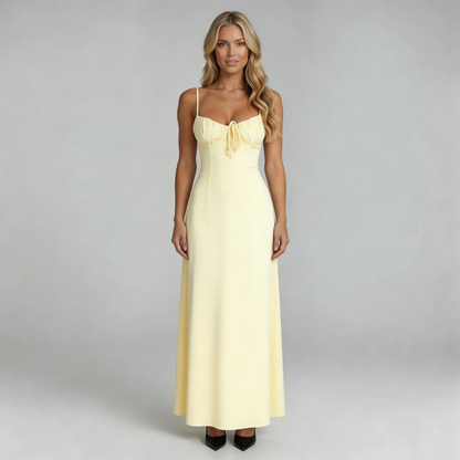 Cream lace-up maxi dress with sweetheart neckline — front view showing tie-front detail and fitted waist.