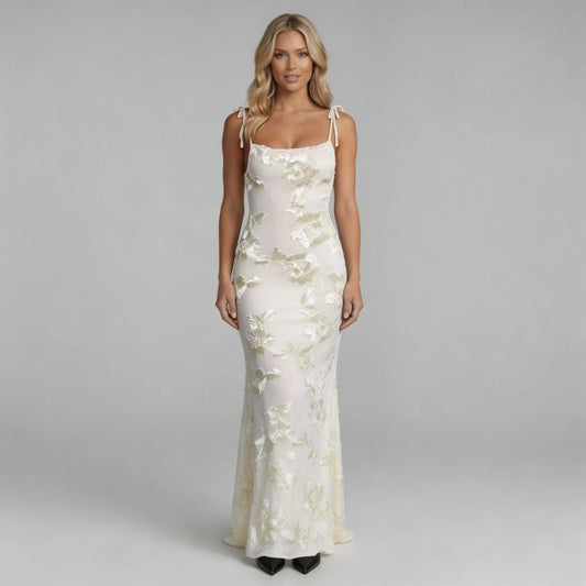 White floral maxi dress with 3D appliqué detailing and square neckline — front view of full-length silhouette.