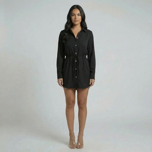 Black tie-waist mini romper with button-down front and collared neckline — front view.