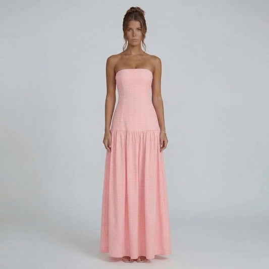 Pink gingham strapless maxi dress — front view showcasing drop-waist ruffled skirt.