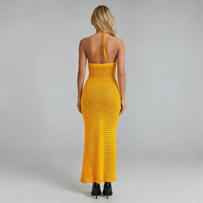 Orange crochet maxi dress with halter tie, back view.
