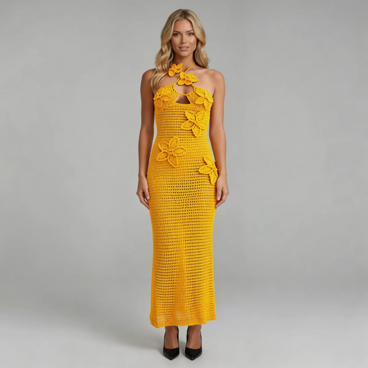 Orange crochet maxi dress with floral appliqué and keyhole, front view.