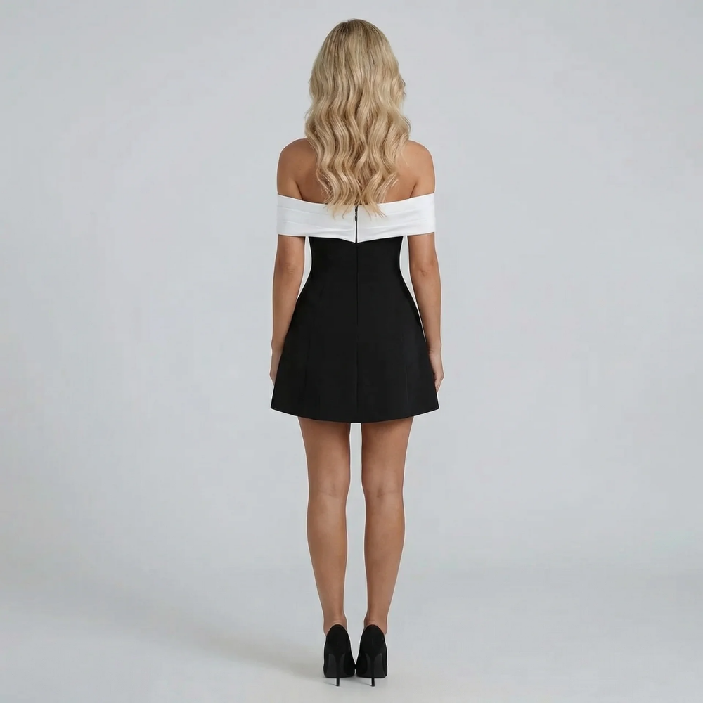 White structured Bardot mini dress with voluminous A-line skirt — styled front view.