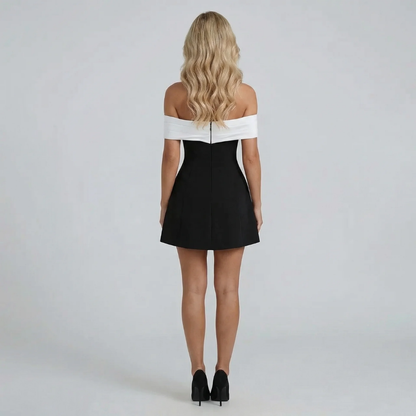 White structured Bardot mini dress with voluminous A-line skirt — styled front view.