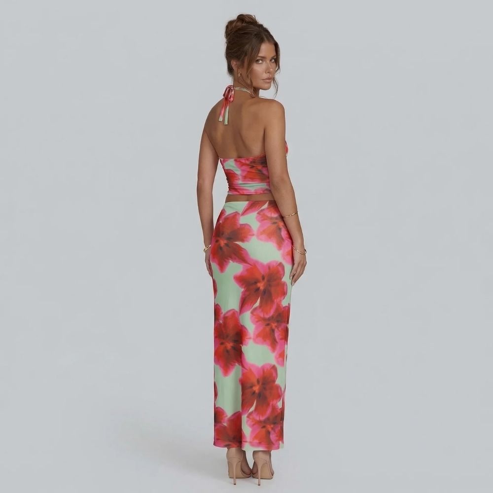 Pink floral halter crop top and maxi skirt — back view highlighting halter ties and fitted waistband.
