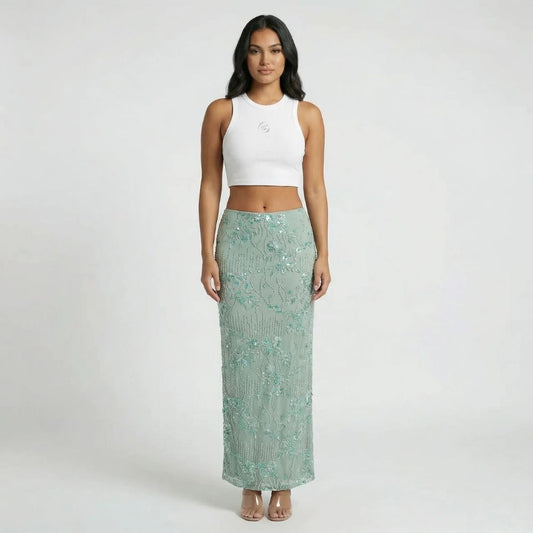 Mint floral sequin maxi skirt with column silhouette — front view.