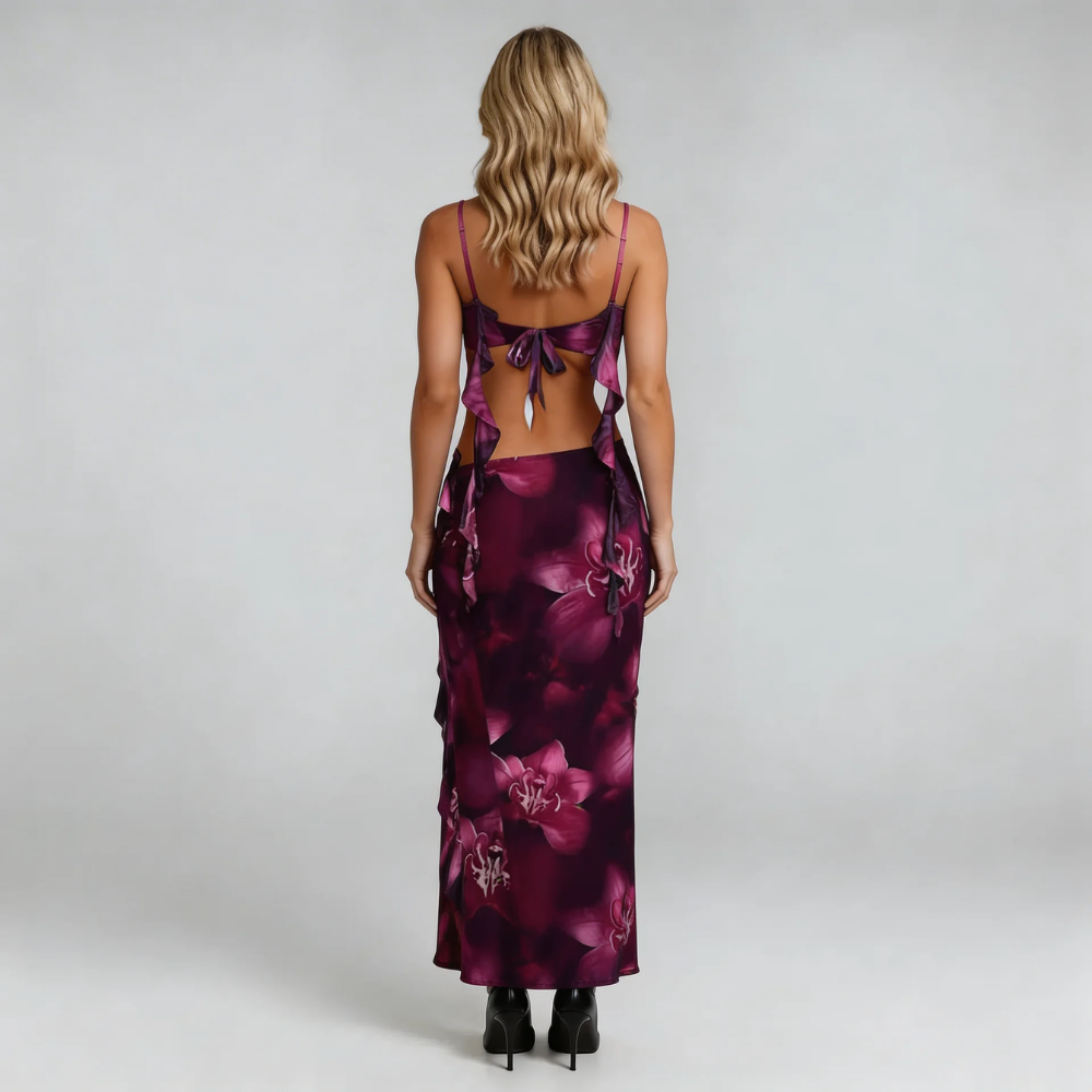 Purple floral maxi skirt and tied-back crop top — back view highlighting open-back tie and ruffle accents.