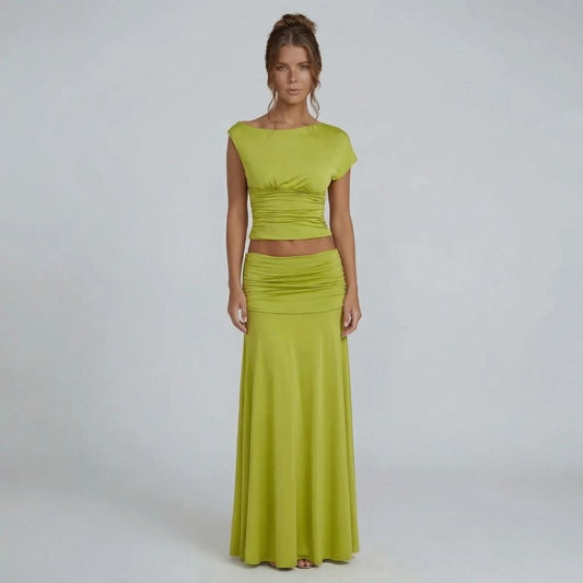 Lime green ruched maxi set with cap sleeve top — front view showcasing elegant boat neckline and floor-length skirt.