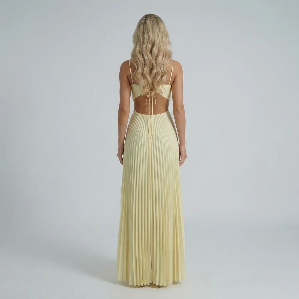 Cream pleated maxi dress showcasing adjustable back ties and open-back detail.