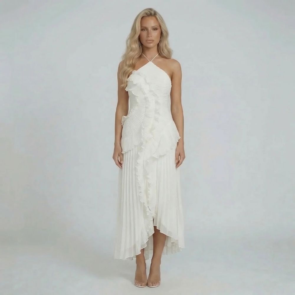 White pleated halter maxi dress with ruffles — front view styled for wedding or formal occasions.