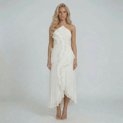 White pleated halter maxi dress with ruffles — front view styled for wedding or formal occasions.
