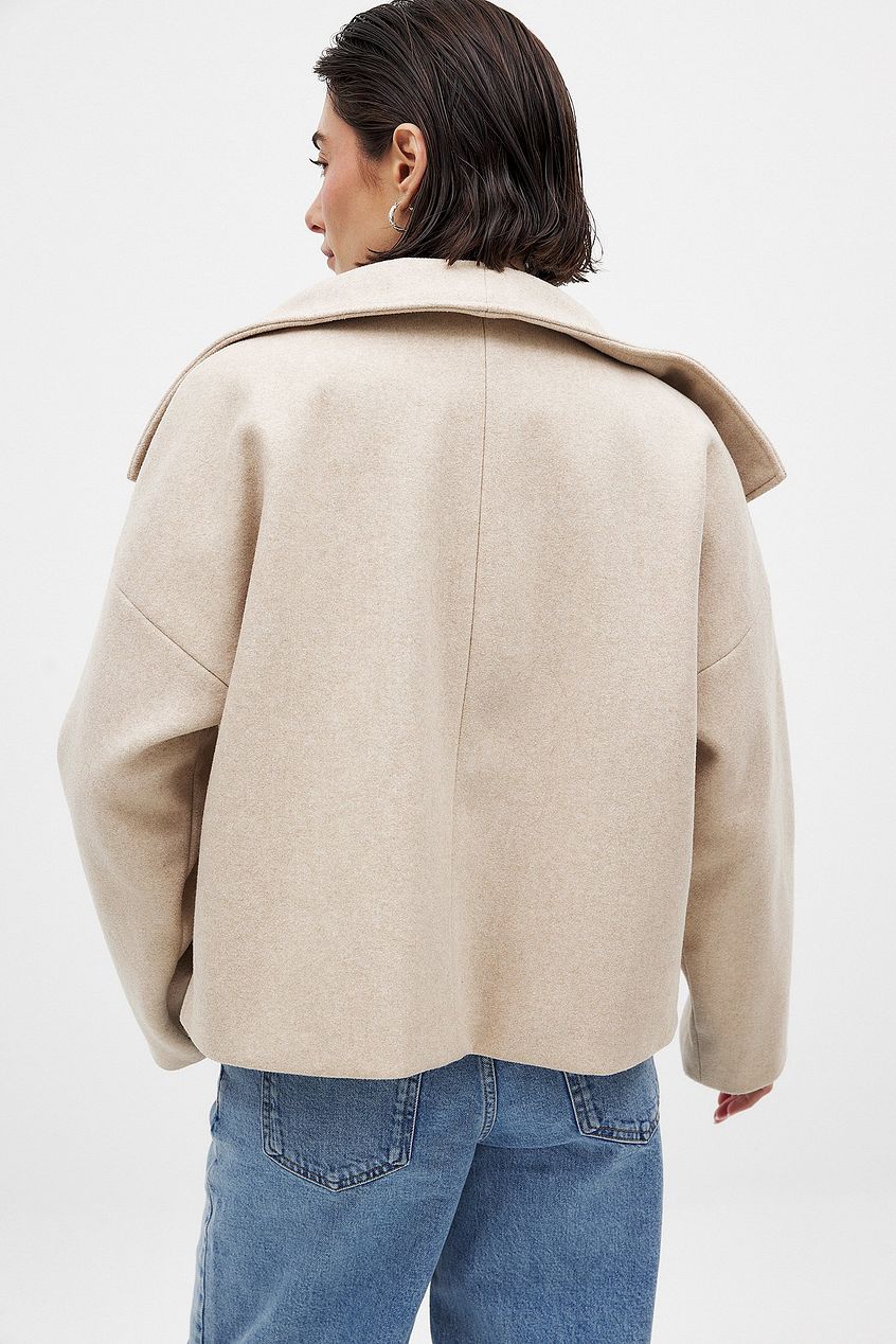 Women beige shawl button jacket, back view