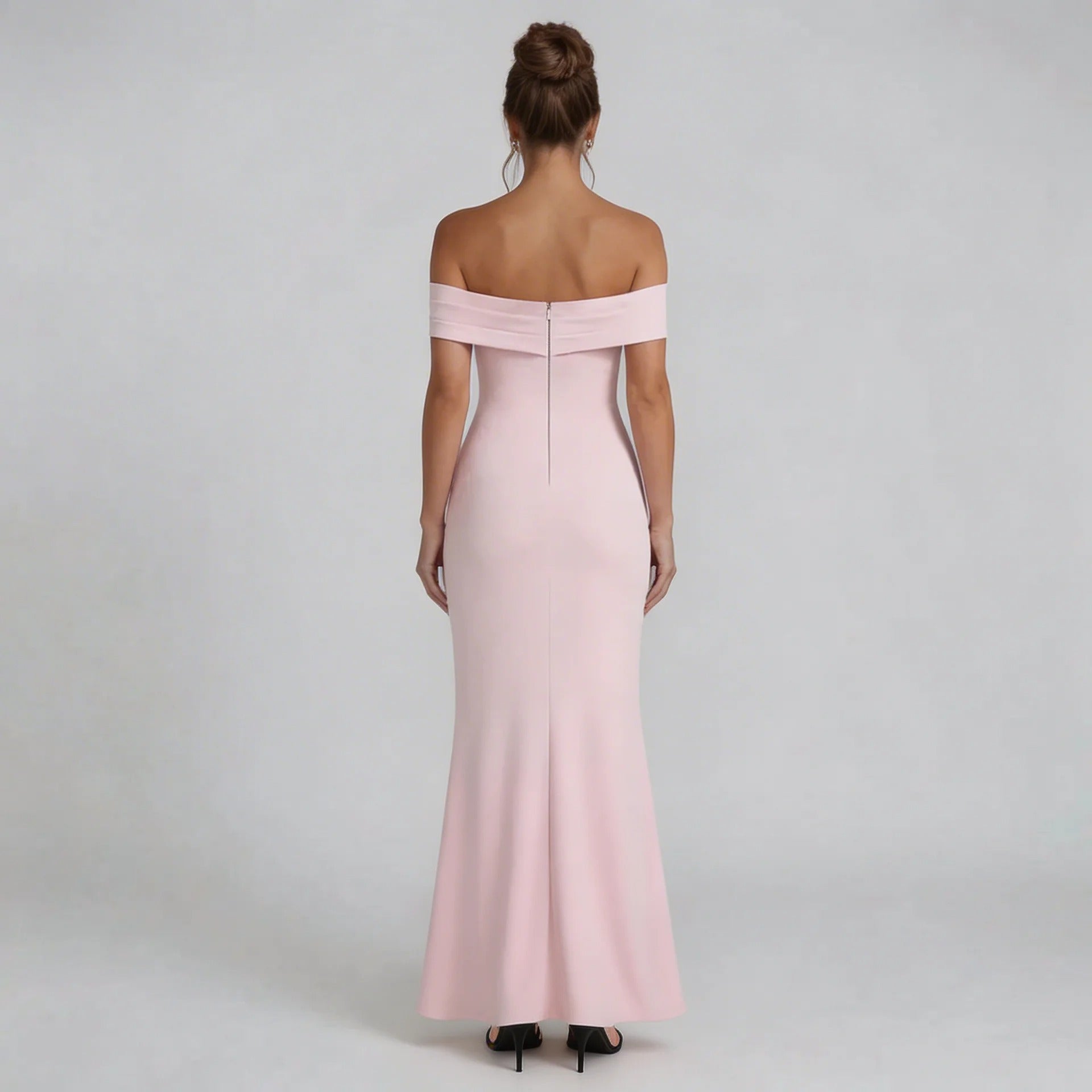 Blush pink Bardot maxi dress with zip-back detail showing fitted silhouette — back view