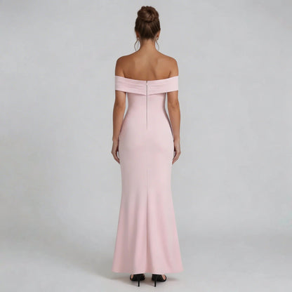 Blush pink Bardot maxi dress with zip-back detail showing fitted silhouette — back view