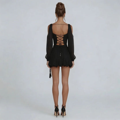 Black chiffon mini dress with corset lace-up back — back view.