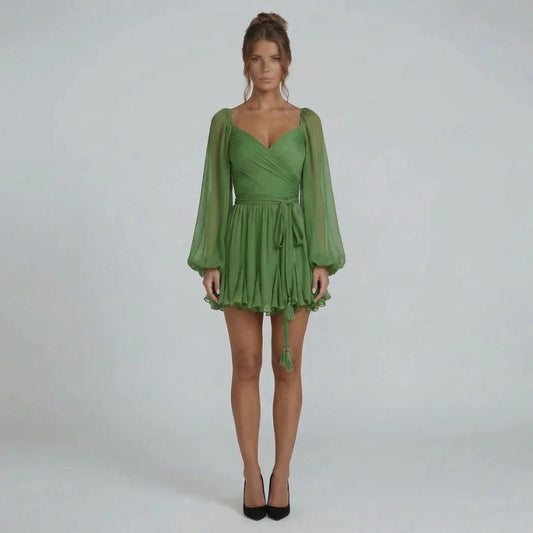 Green chiffon mini dress with sweetheart neckline and ruffled hem — front view.