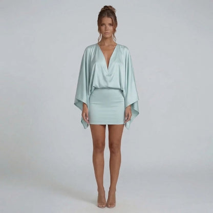 Blue cape-style mini dress with batwing sleeves and curve-skimming skirt — front perspective highlighting details.