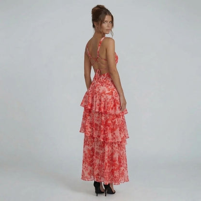 Red floral tiered maxi dress with lace-up back and ruffle detailing — back view.