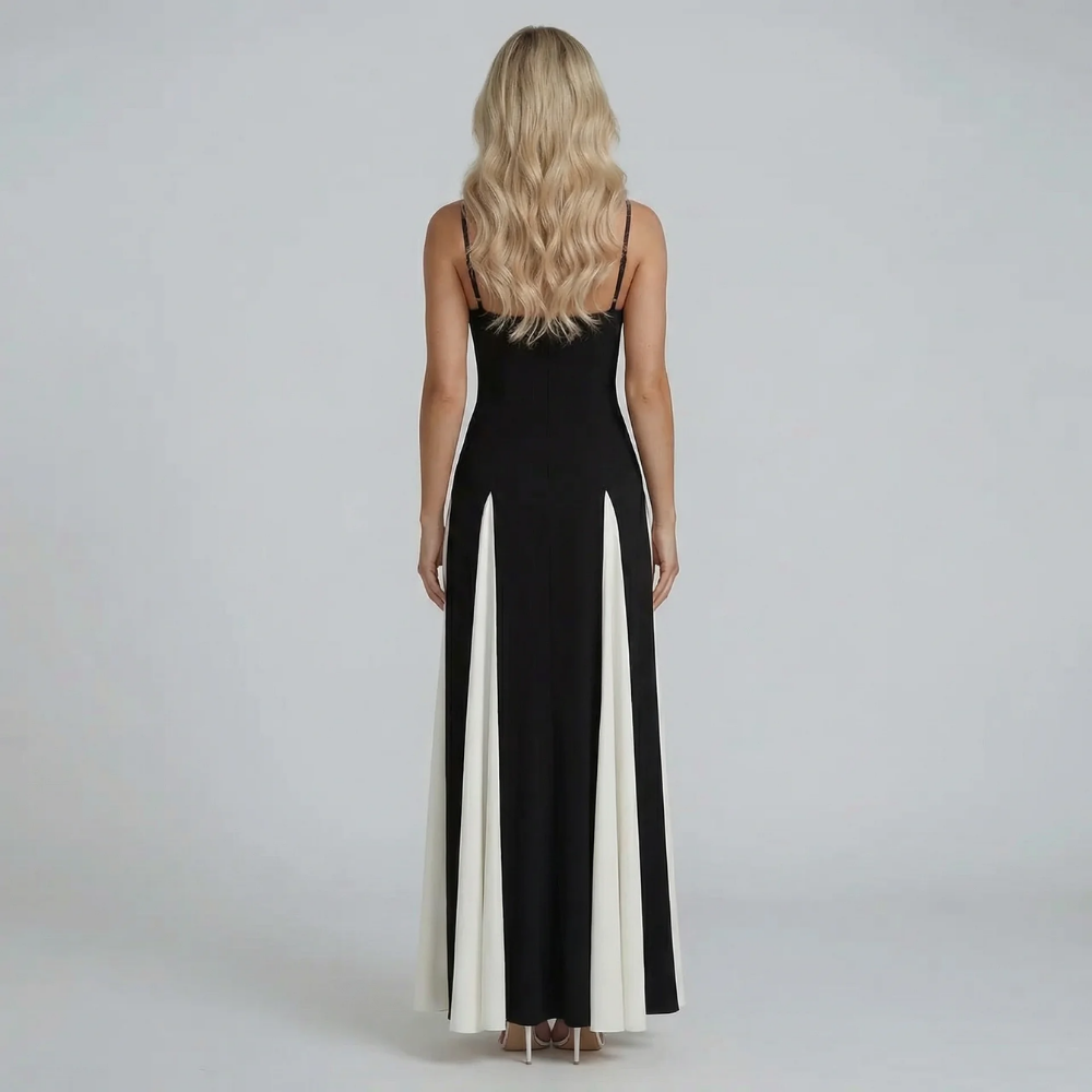 Black and ivory colorblock maxi dress — back view highlighting low back and flowing skirt details.
