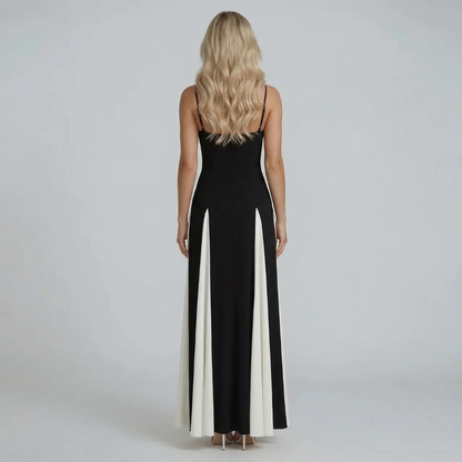 Black and ivory colorblock maxi dress — back view highlighting low back and flowing skirt details.