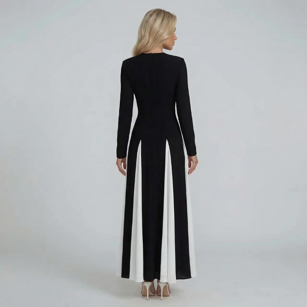 Black and ivory long-sleeve maxi dress — back view highlighting sleek design and modern elegance.