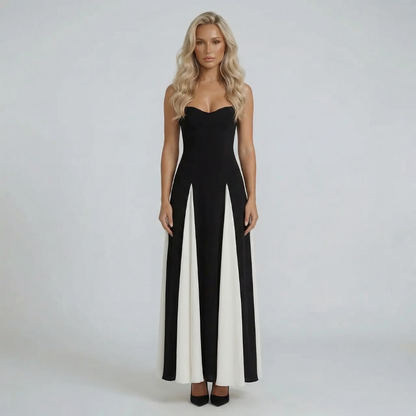 Black and ivory colorblock sweetheart neck maxi dress — front view showing pleated contrast panels.