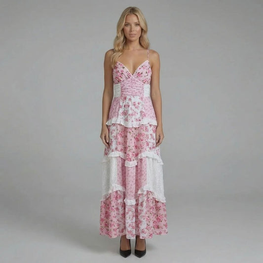 Pink floral tiered maxi dress with V-neckline — front view highlighting ruffled skirt details
