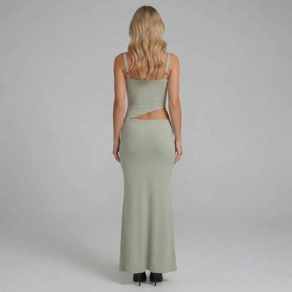 Sage cutout maxi dress featuring cutout waist — back angled view with flowing silhouette.