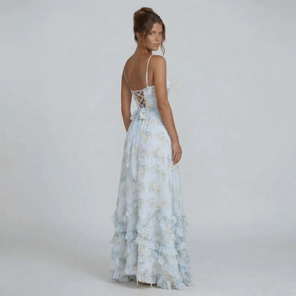 White floral maxi dress with bow detail on lace-up back, side angle.